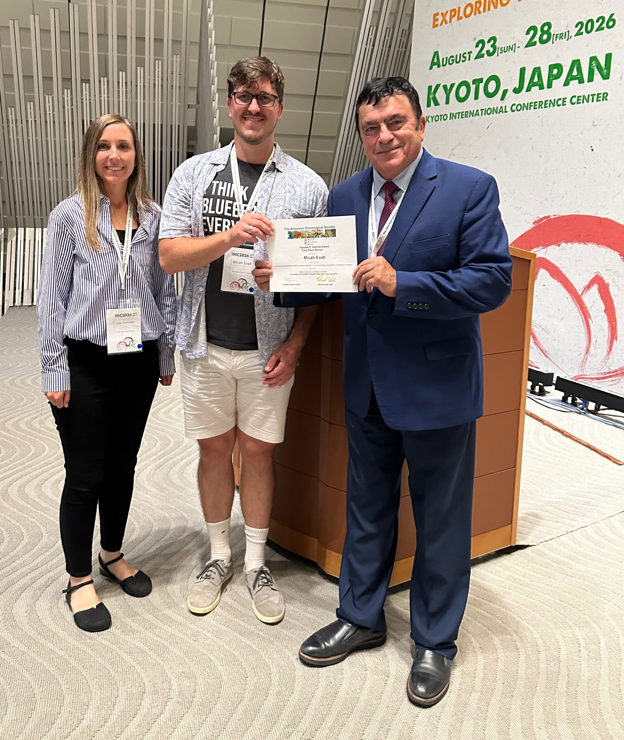 Student, Micah and co-author receiving award from UP Hedrick Chair